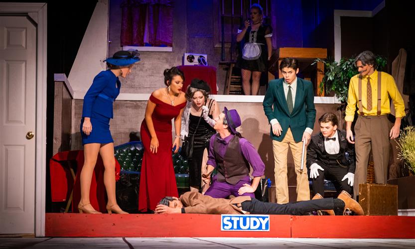 Students perform Clue onstage